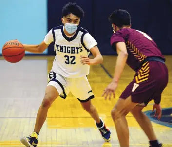  ?? ADOLPHE PIERRE-LOUIS/JOURNAL ?? Del Norte’s Shane Douma-Sanchez, left, dribbles against Valley’s Isaac Tapia on April 13. Douma-Sanchez is the top scorer in Class 4A, averaging 26.4 points per game.