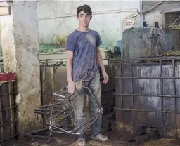  ??  ?? that will be exported to the Balkans. Bakri is 12 and works at a furniture workshop. Daoud, 16, is responsibl­e for rubbing the frames of chrome chairs with sawdust until every trace of water has been absorbed.