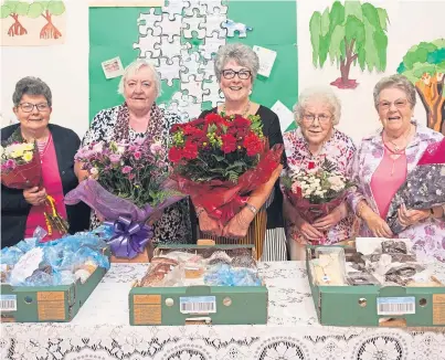 ?? Picture: Paul Smith. ?? Iris and Ann, second and third left, are flanked by Isabell Fowlie, Betty Watson and Helen Anderson as they bid farewell to their fundraisin­g days.