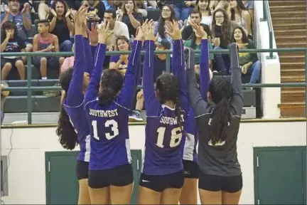  ?? KARINA LOPEZ PHOTO ?? The Southwest High volleyball team celebrates a block during an away volleyball match at Holtville High on Thursday night.