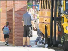  ?? Hearst Connecticu­t Media file photo ?? Students step off the bus at McKinley Elementary School in Fairfield on Aug. 30, 2018.