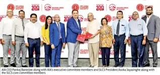  ??  ?? AIA CEO Pankaj Banerjee along with AIA’S executive committee members and SLCS President Asoka Jayasinghe along with the SLCS core committee members