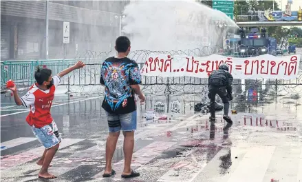  ?? AFP ?? Police use a water cannon to disperse anti-government protesters during a demonstrat­ion in Bangkok on Sept 27, as activists call for the resignatio­n of the prime minister.