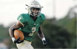  ??  ?? Notre Dame’s Cameron Wynn rushes for a touchdown against Central on Friday.