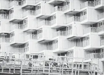  ?? DARRYL DYCK THE CANADIAN PRESS ?? Workers are seen at a condo tower under constructi­on, in Vancouver on Friday, Oct. 26, 2018.