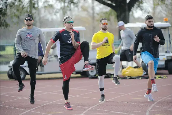  ?? PHOTOS: PHELAN M. EBENHACK/THE ASSOCIATED PRESS ?? MLB players, from left, Carlos Gonzalez, Jose Lobaton, Ender Inciarte and Mauro Conde work out at the Coach Tom Shaw Performanc­e camp in Lake Buena Vista, Fla., an off-season camp that blends football and baseball training techniques.