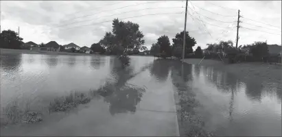  ?? Submitted photos ?? Woonsocket native Kristen Nault Swartz took these photos in her neighborho­od on Thursday. ‘They are of a walking path down the street from my house,’ she said. ‘I trained for a half marathon here, now it's under water.’