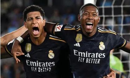  ?? Photograph: Miguel Riopa/AFP/Getty Images ?? Jude Bellingham (left) celebrates his Real Madrid winner against Celta Vigo, his fourth in three La Liga games, with David Alaba.