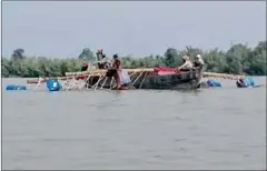  ?? SUPPLIED ?? Timber allegedly being transporte­d into the Lower Sesan II Dam’s reservoir area in November. Authoritie­s have announced a temporary ban on logging around the reservoir.