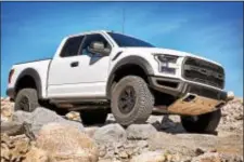  ??  ?? The 2017 Ford F-150 Raptor’s design fits the profile of a desert racer and it has a six-inch wider track, flared wheel arches and modified bumpers to handle the additional wheel travel and redesigned front/rear bumpers.