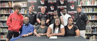  ??  ?? Family and coaches joined Tamera Beeman for her signing with the Community College of Beaver County.