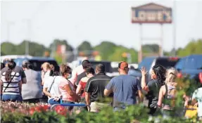  ?? ELI HARTMAN/ ODESSA AMERICAN VIA AP ?? A line of more than 50 people stands outside of Lowe’s Home Improvemen­t in Midland, Texas, on Friday as customers wait to enter the store as part of a COVID-19 guideline. Since the lockdown in the Permian Basin, many people have taken to home improvemen­t, gardening, and working on projects during their quarantine as a way to pass the time.