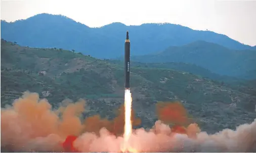 ??  ?? THREAT: Yesterday’s test is thought to have been a Hwasong-12 ballistic missile, seen here being launched at an undisclose­d location