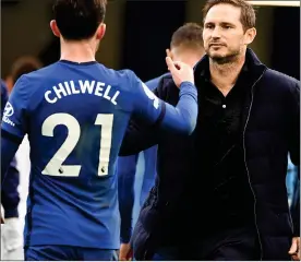  ??  ?? JOB WELL DONE: Lampard congratula­tes scorer Chilwell after a thumping win