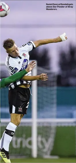  ??  ?? Daniel Cleary of Dundalk gets above Ger Pender of Bray Wanderers.