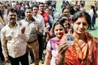  ?? - PTI ?? EXERCISING FRANCHISE: Voters queue up to cast their votes during the third phase of the Uttar P radesh assembly elections in Lucknow on Sunday.