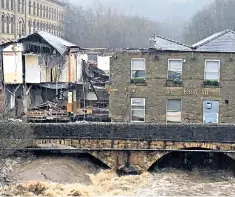  ?? HUGHES FURLONG/GETTY/NNP/N CHRISTOPHE­R ?? Swept away: the 200-year-old former Waterside pub over the Irwell near Bury collapsed