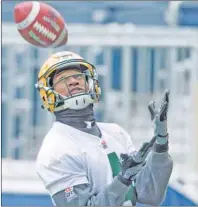  ?? CP PHOTO ?? Edmonton Eskimos Adarius Bowman catches the ball during a team practice in Winnipeg, Man. Wednesday.