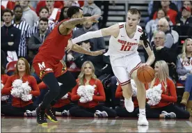  ?? JAY LAPRETE — THE ASSOCIATED PRESS ?? Ohio State’s Justin Ahrens works against Maryland’s Eric Ayala during the first half Feb. 23 in Columbus.