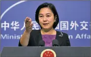  ?? AP/MARK SCHIEFELBE­IN ?? “We will never allow Chinese citizens and enterprise­s to engage in activities that violate Security Council resolution­s,” Hua Chunying, a Chinese Foreign Ministry spokesman, said Friday in denying that Beijing had violated limits on oil supplies to...