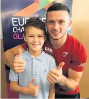  ??  ?? Meet and greet Ethan O’rourke (8), a member of HGC, was star-struck after meeting Britain’s Dominick Cunningham, who won European floor gold