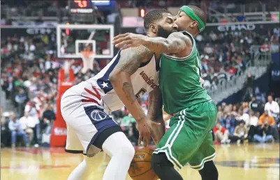  ?? USA TODAY SPORTS ?? Washington Wizards forward Markieff Morris has no place to go as Boston Celtics guard Isaiah Thomas stands his ground in the third quarter of Thursday’s Game 3 of their NBA Eastern Conference semifinal at Verizon Center in Washington, DC.