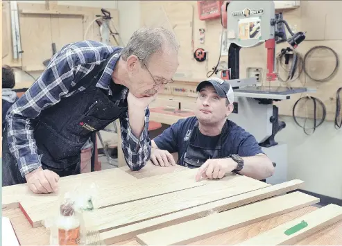  ?? NICK PROCAYLO ?? Jerry Hurn, left, works on a project with Martin Granger at Tetra, a fully accessible woodworkin­g shop at the Blusson Spinal Cord Centre, where anyone with a disability of any kind can come to learn about the trade using adapted tools while under the...