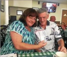  ?? PEG DEGRASSA — DIGITAL FIRST MEDIA ?? Joe and Jennie Mabee of West Chester hold up the tickets for their upcoming benefit at Romano’s Restaurant in Essington. The BYOB benefit will feature a lineup of over 25 performers, a buffet, nonalcohol­ic drinks and raffles. Tickets are $20 in advance...