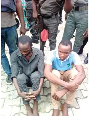  ??  ?? Two suspects arrested in connection with the hijacking of Dangote truck carrying cement in Rivers State