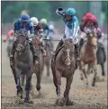  ?? Matt stone/usa Today sports ?? Jockey Javier Castellano raises his fist in celebratio­n after he and Mage won the 149th Kentucky Derby on Saturday at Churchill Downs in Louisville, Ky. May, 6.