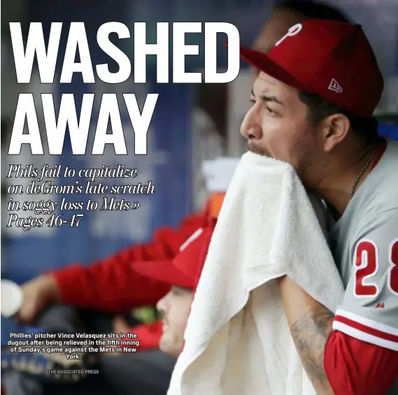  ?? THE ASSOCIATED PRESS ?? Phillies’ pitcher Vince Velasquez sits in the dugout after being relieved in the fifth inning of Sunday’s game against the Mets in New York.