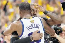  ?? EZRA SHAW/GETTY IMAGES ?? Kevin Durant of the Golden State Warriors and LeBron James of the Cleveland Cavaliers shake hands after Game 5 of the 2017 NBA Finals.