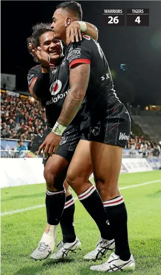  ?? GETTY IMAGES ?? Solomone Kata congratula­tes Ken Maumalo on the latter’s try for the Warriors against the Tigers.