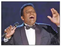  ?? (AP file/Charlie Neibergall) ?? Charley Pride performs in October 2000 during his induction into the Country Music Hall of Fame at the Country Music Associatio­n Awards show at the Grand Ole Opry House in Nashville, Tenn. Pride died Saturday in Dallas of complicati­ons from covid-19, sources say.