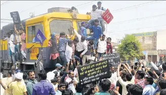  ?? HT FILE PHOTO ?? Dalits stop a train in Allahabad to protest against the apex court’s decision to ban automatic arrests and registrati­on of criminal cases under the SC/ST (Prevention of Atrocities) Act in its March 20 order.