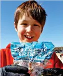  ?? ?? Waste: Laurence Miller, ten, with a 30-year-old crisp pack