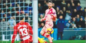  ?? (Joan Monfort/AP) ?? FC Barcelona's Lionel Messi kicks the ball during the Spanish La Liga soccer match between Espanyol and FC Barcelona at RCDE stadium in Cornella Llobregat, Spain.