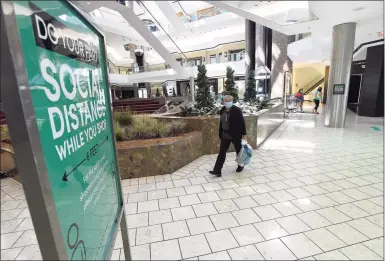  ?? Hearst Connecticu­t Media file photo ?? Patrons walk around at a virtually empty mall at the Stamford Town Center on May 20 in Stamford.