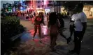  ??  ?? People enjoy spring break festivitie­s ahead of an 8pm curfew imposed by local authoritie­s in Miami Beach this week. Photograph: Marco Bello/Reuters