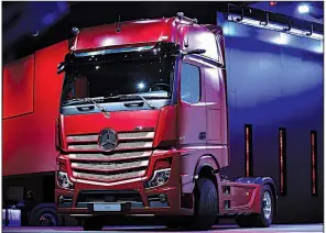  ?? Bloomberg News file photo ?? A new Mercedes-Benz Actros semi-autonomous truck sits onstage at September’s IAA Commercial Vehicles Show in Hanover, Germany.