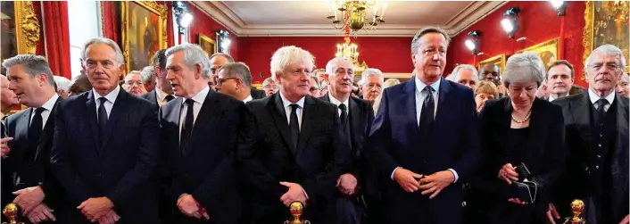  ?? ?? LEADERS’ LINE-UP: Keir Starmer, Tony Blair, Gordon Brown, Boris Johnson, David Cameron, Theresa May and John Major at St James’s Palace. Below: King Charles III arrives at Buckingham Palace