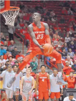  ?? JIM THOMPSON/JOURNAL ?? University of New Mexico freshman Emmanuel Kuac, the presumed coming into Saturday’s festivitie­s, won the dunk contest. favorite