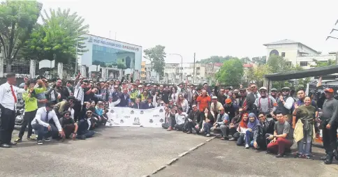  ??  ?? The big bike riders, pillion riders and organising committee members pose for a group photograph at Borneo Superbikes in Pending yesterday before embarking on the journey to Bau.