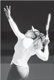  ?? MICHAEL DODGE GETTY IMAGES ?? Roger Federer and Serena Williams in action at the Hopman Cup.