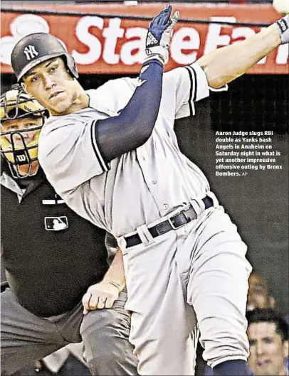  ?? AP ?? Aaron Judge slugs RBI double as Yanks bash Angels in Anaheim on Saturday night in what is yet another impressive offensive outing by Bronx Bombers.