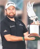  ??  ?? CHAMPION Lowry with trophy yesterday