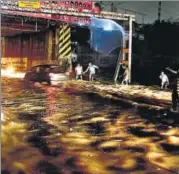  ?? PTI PHOTO ?? The sudden downpour, which lasted for five hours on Monday night, was initially described as a cloud burst but later reclassifi­ed as heavy rainfall.