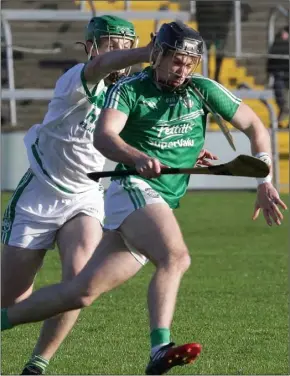  ??  ?? Naomh Eanna corner-back Eoin Conroy is pursued by Eoin Cody of Shamrocks.