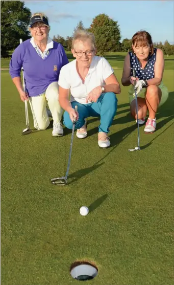  ?? Photo by John Tarrant. ?? Grace Dennehy, Peggy O’Donoughue and Elaine McCarthy lining up a birdie putt on their way to winning the Millstreet GAA Golf Classic.