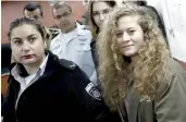  ?? — AFP ?? Seventeen- year- old Palestinia­n Ahed Tamimi, a well- known campaigner against Israel’s occupation, arrives for the beginning of her trial in the Israeli military court at Ofer military prison in the West Bank village of Betunia on Tuesday.